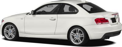 Rear-side view of white compact coupe with dual exhaust and alloy wheels