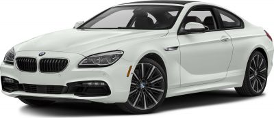 Front and side view of a white luxury sports coupe with detailed headlights and alloy wheels