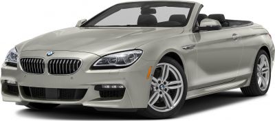 Front view of a luxury convertible with LED headlights and sporty alloy wheels.