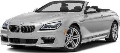 Silver convertible with sporty front grille and headlights, open roof design.