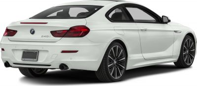 Rear and side profile of a luxury coupe with distinctive tail lights and alloy wheels