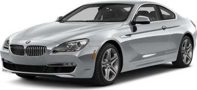 Front side view of a silver luxury coupe with alloy wheels