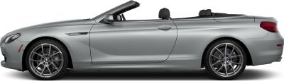 Side profile of silver convertible with open roof and alloy wheels