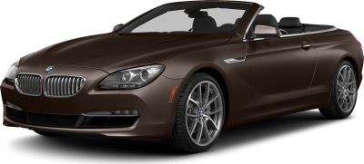 Front grille, headlights, and alloy wheels of a luxury convertible.