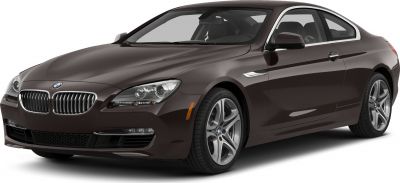Front side view with headlights and alloy wheels of a coupe